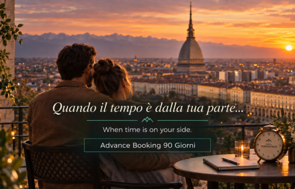 Coppia su una terrazza al tramonto con vista su Torino e la Mole Antonelliana – offerta Advance Booking 90 giorni Hotel Miramonti